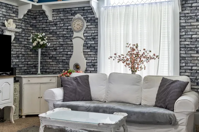a spacious bathroom with a sink double vanity granite and a mirror