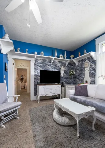 a kitchen with a sink a stove a refrigerator and cabinets