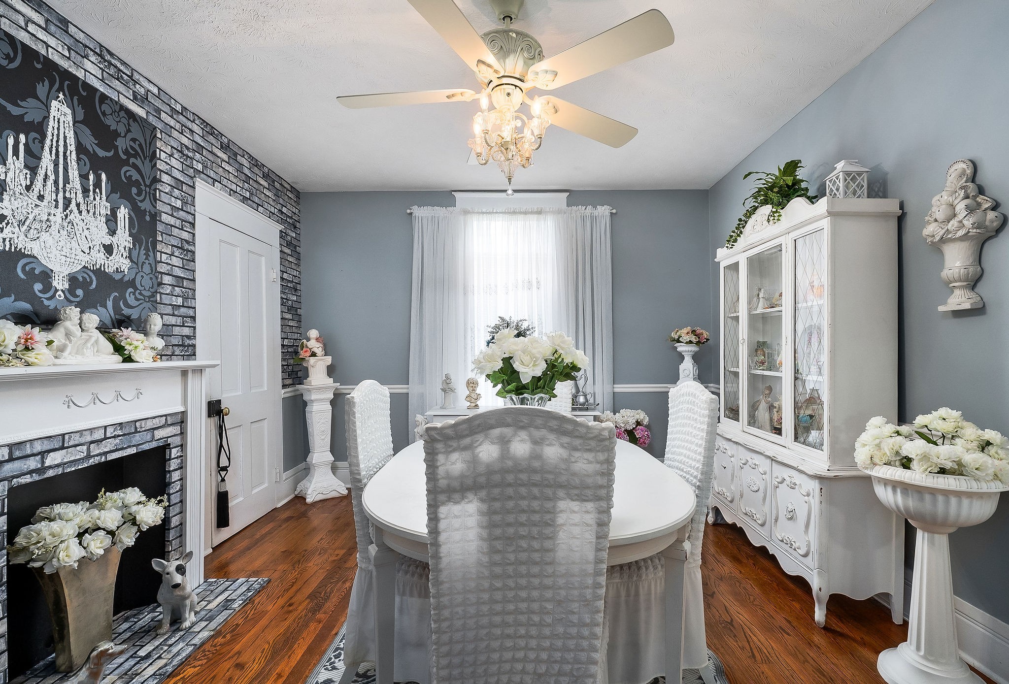 107 North Main Street Sparta, TN 38583 - Photo 19 of 70 a living room with furniture a fireplace and a chandelier