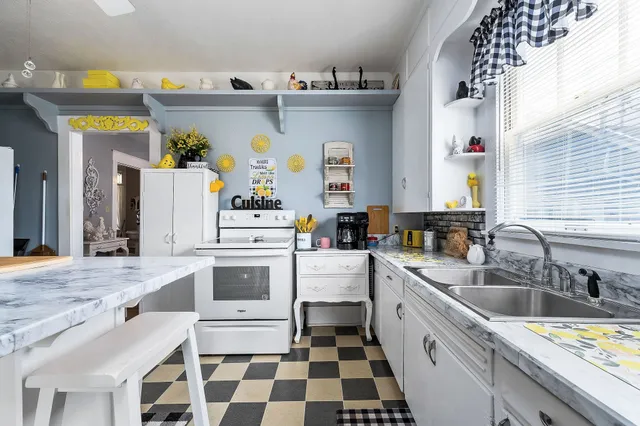 a bedroom with a bed and flat screen tv