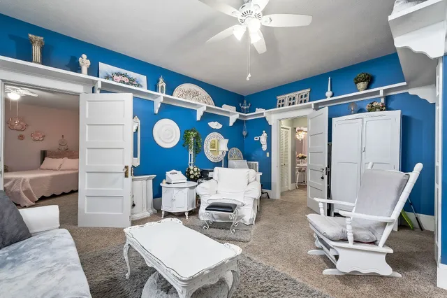 a bedroom with a bed and a table in it