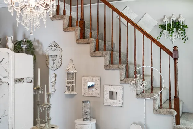 a bedroom with furniture and a chandelier