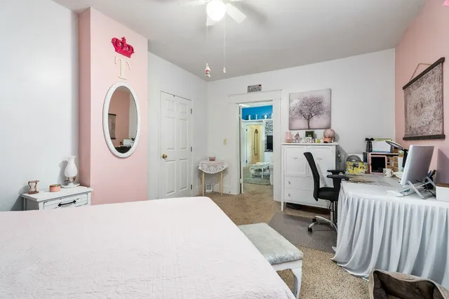 a bathroom with a toilet a sink and a mirror
