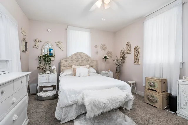 a flower pot on a dining table chair and a potted plant