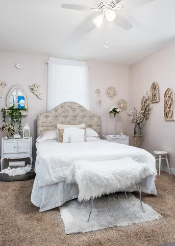 a kitchen with a sink a stove and wooden cabinets