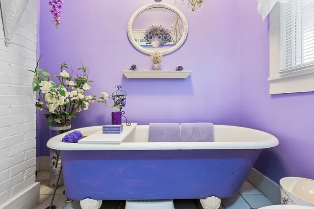 an aerial view of residential houses with outdoor space and street view