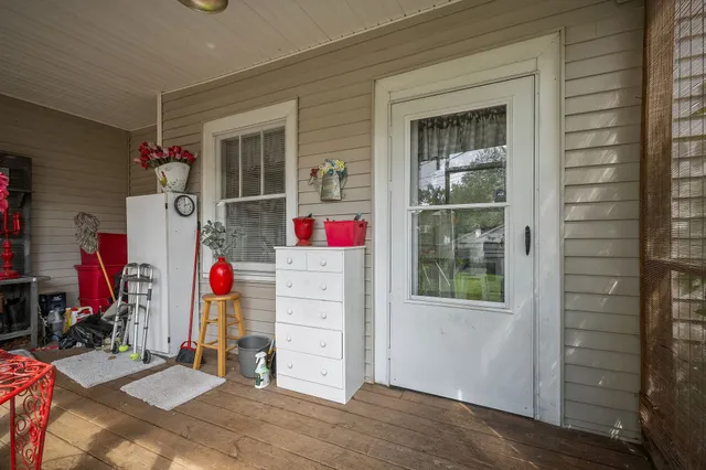 an aerial view of a house with garden space and street view