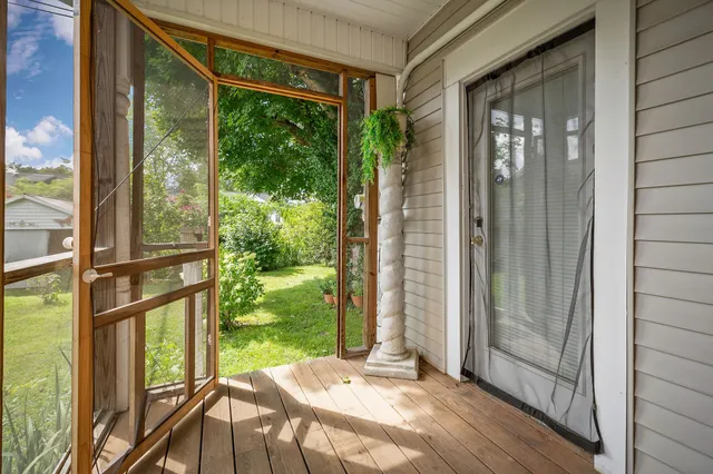 an aerial view of residential houses with outdoor space and street view