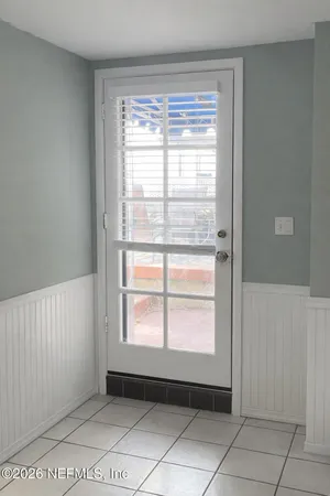 a reading room with furniture and wooden floor