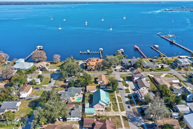 an aerial view of residential house with outdoor space and parking