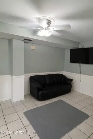 a living room with furniture and a window