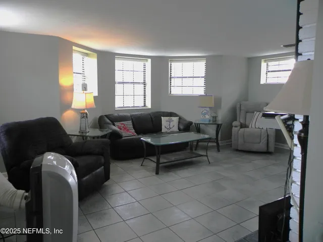 a room with furniture and a flat screen tv