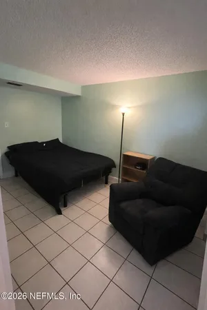 a view of swimming pool with outdoor seating and yard in the back