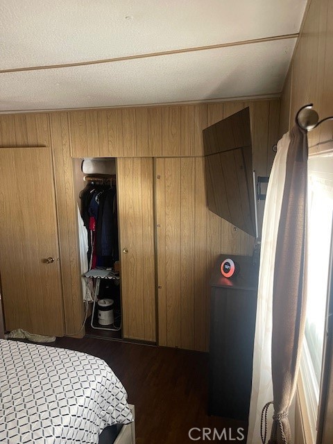 1560 Massachusetts Avenue, Unit 123 Riverside, CA 92507 - Photo 10 of 15 a bedroom with a bed and a refrigerator