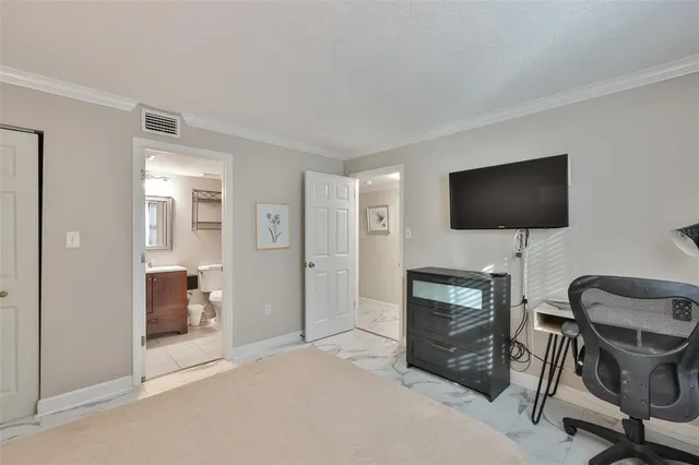 a view of a livingroom with furniture and a flat screen tv