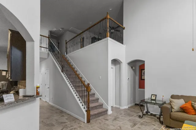 a view of entryway with wooden stairs
