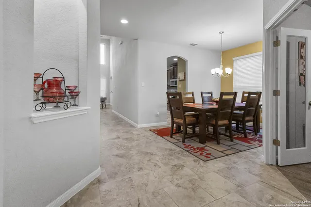 a view of a room with furniture and a window