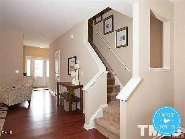 a view of entryway and hall with wooden floor