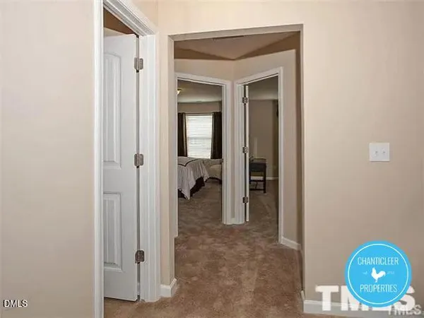 a view of a bathroom from a hallway