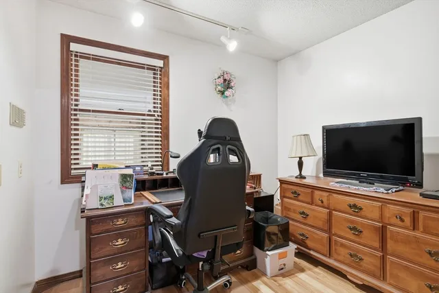 a living room with furniture and flat screen tv