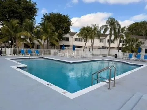 a view of swimming pool with outdoor seating