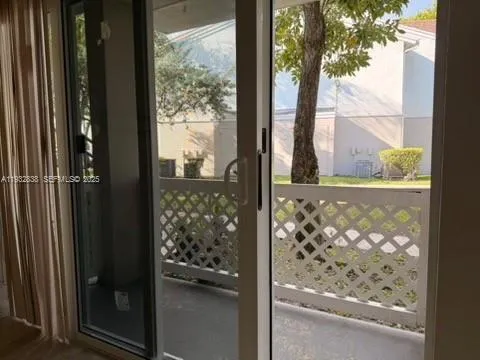 a view of entryway with wooden fence