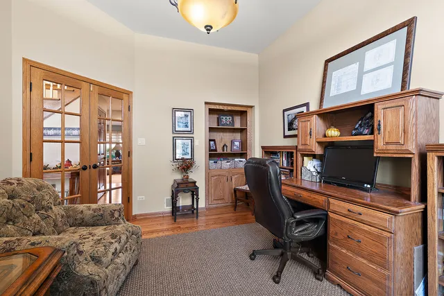 a view of entryway with dining room and wooden floor