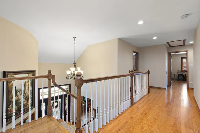 a spacious bedroom with a bed a couch and dresser