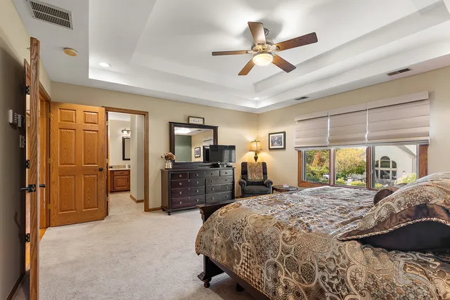 a bathroom with double sink and a mirror