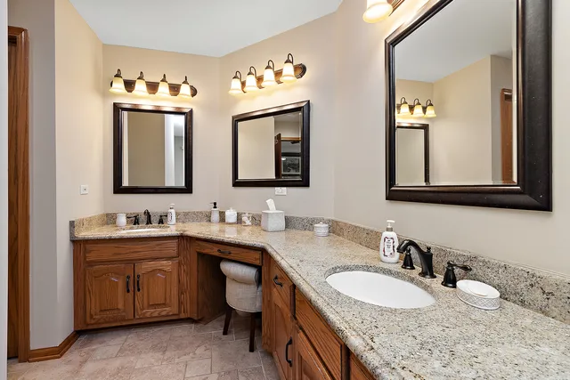 a bathroom with a tub a toilet and a shower