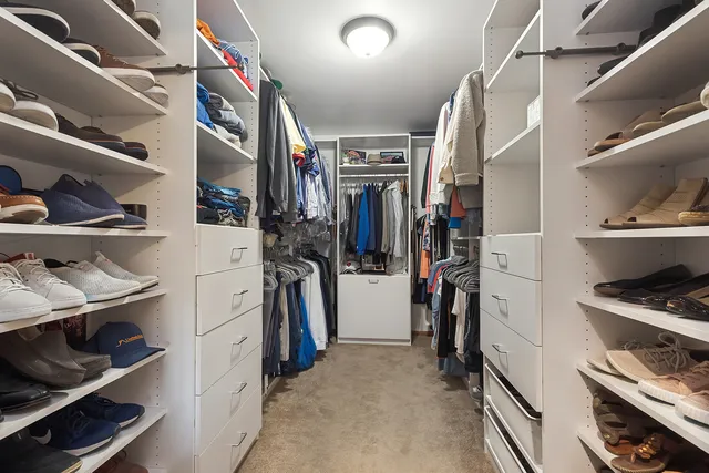 a bedroom with furniture and a wooden floor