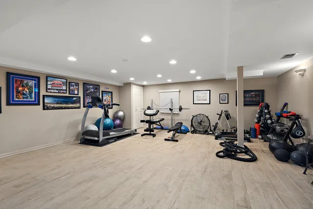 a bathroom with a sink toilet vanity and mirror