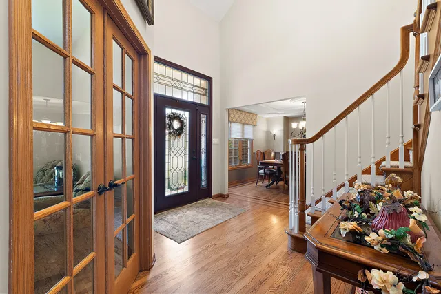a view of entryway livingroom and hall with wooden floor