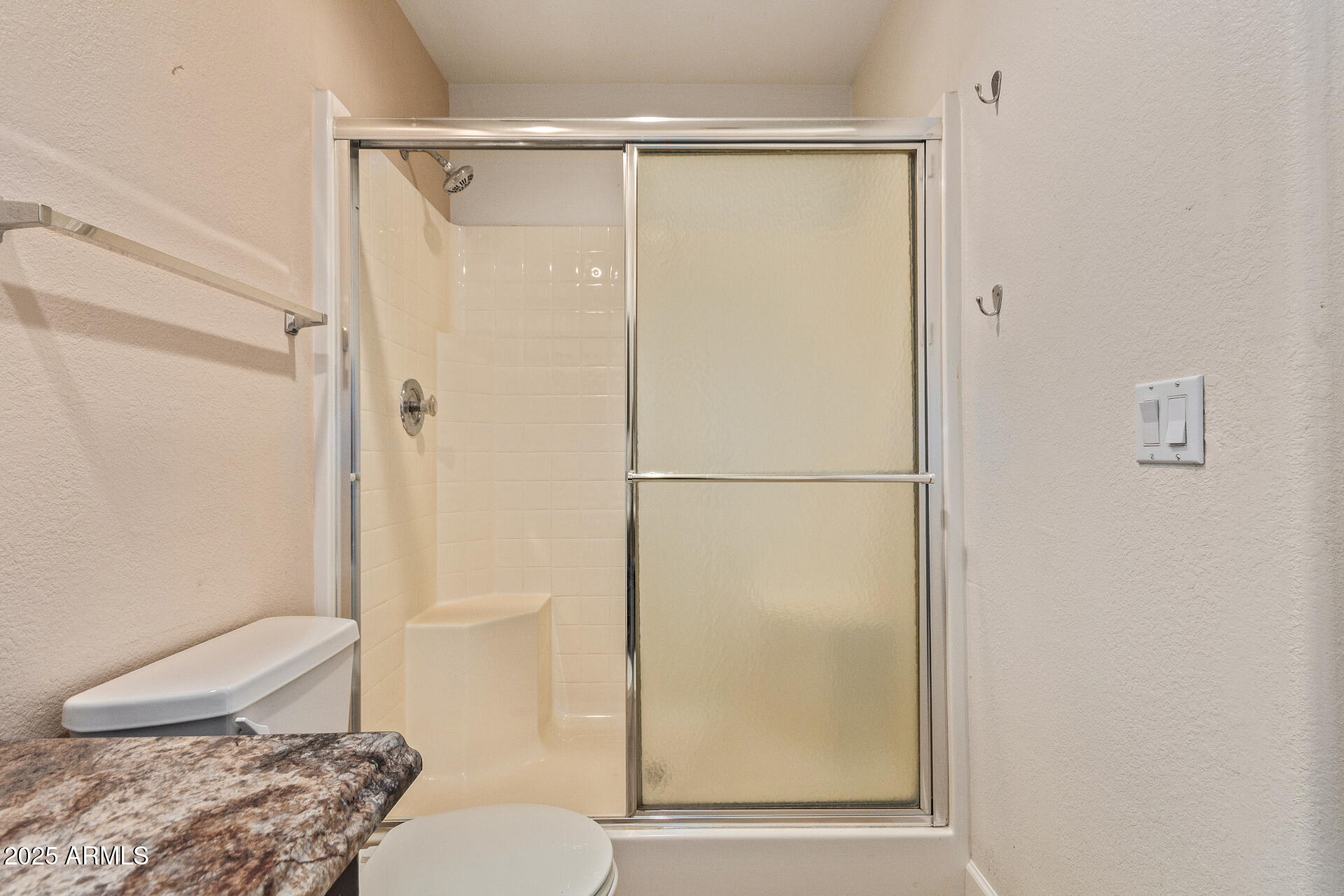 7101 West Beardsley Road, Unit 451 Glendale, AZ 85308 - Photo 11 of 26 a bathroom with a shower and a toilet