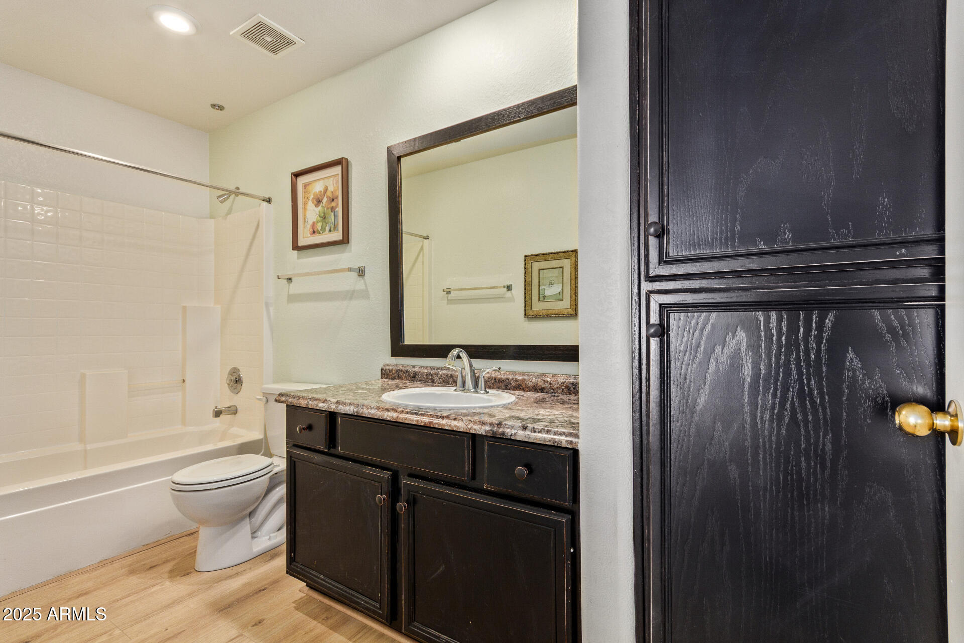 7101 West Beardsley Road, Unit 451 Glendale, AZ 85308 - Photo 16 of 26 a bathroom with a granite countertop sink toilet and shower