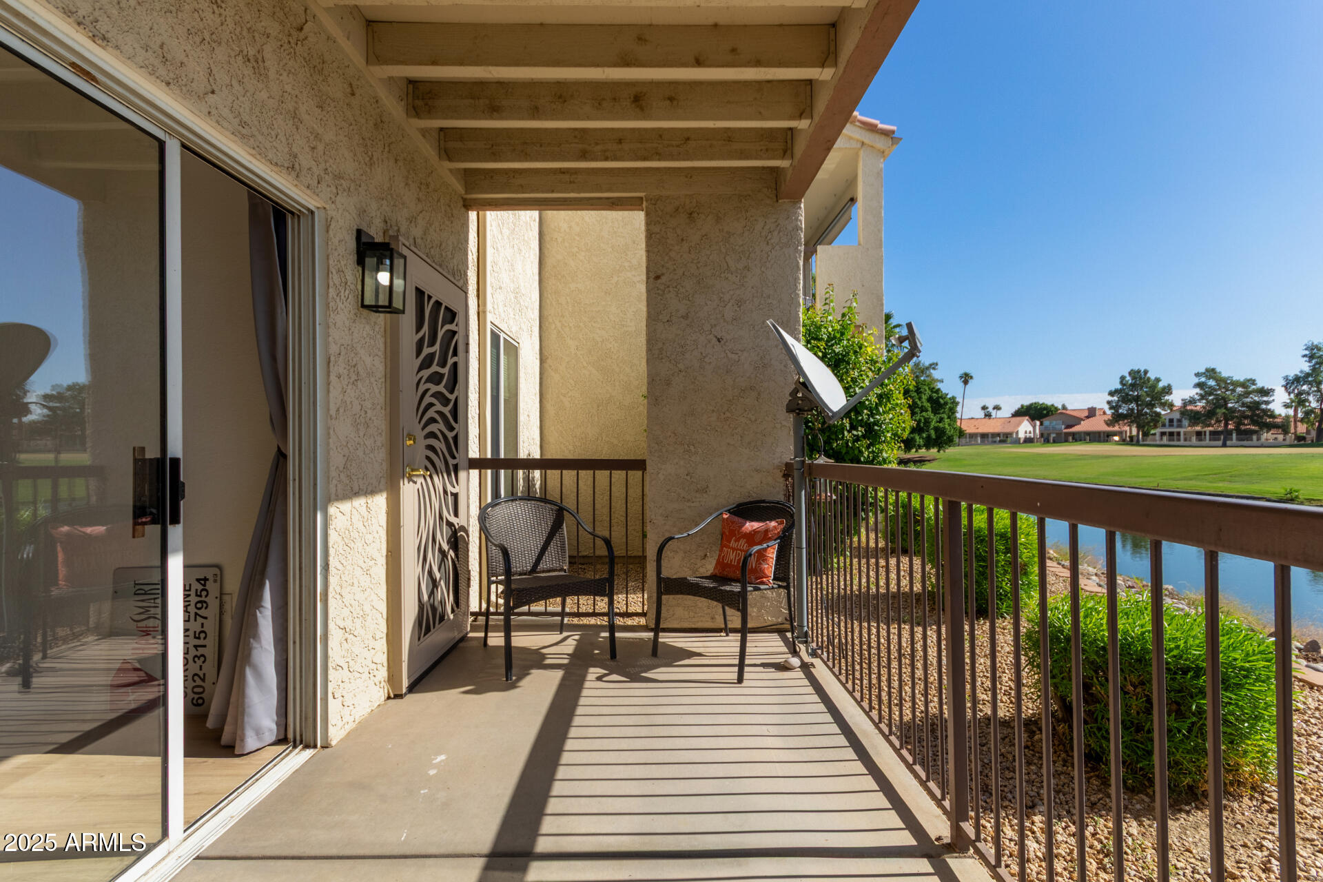 7101 West Beardsley Road, Unit 451 Glendale, AZ 85308 - Photo 21 of 26 a view of balcony with wooden floor and seating space