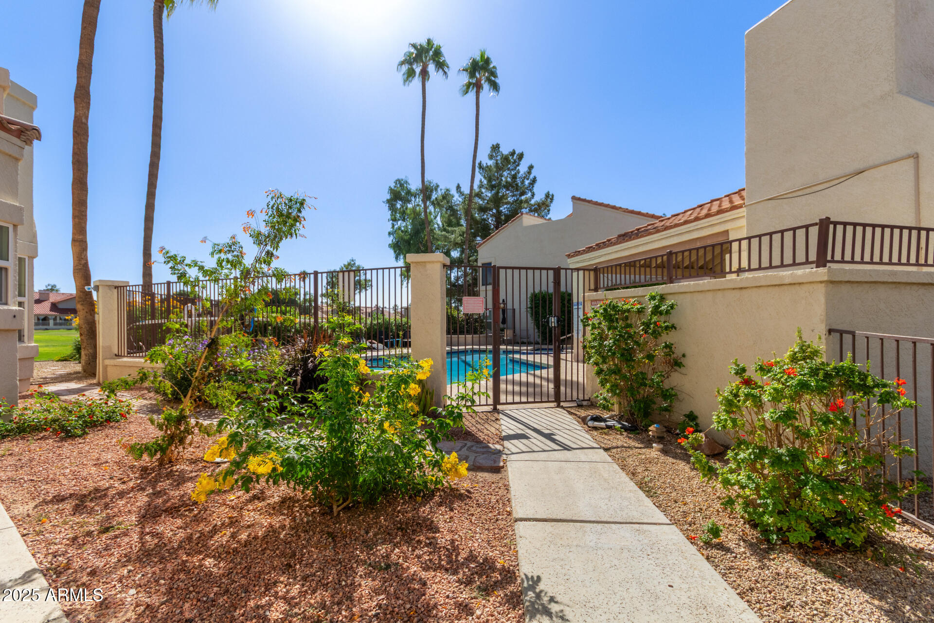 7101 West Beardsley Road, Unit 451 Glendale, AZ 85308 - Photo 23 of 26 a front view of a house with a yard