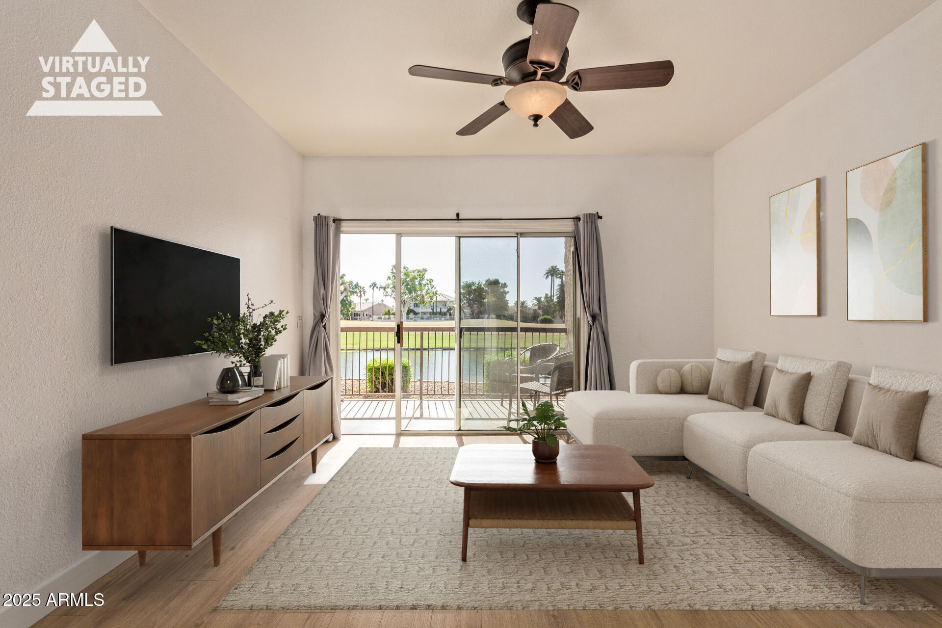 7101 West Beardsley Road, Unit 451 Glendale, AZ 85308 - Photo 4 of 26 a living room with furniture and a flat screen tv