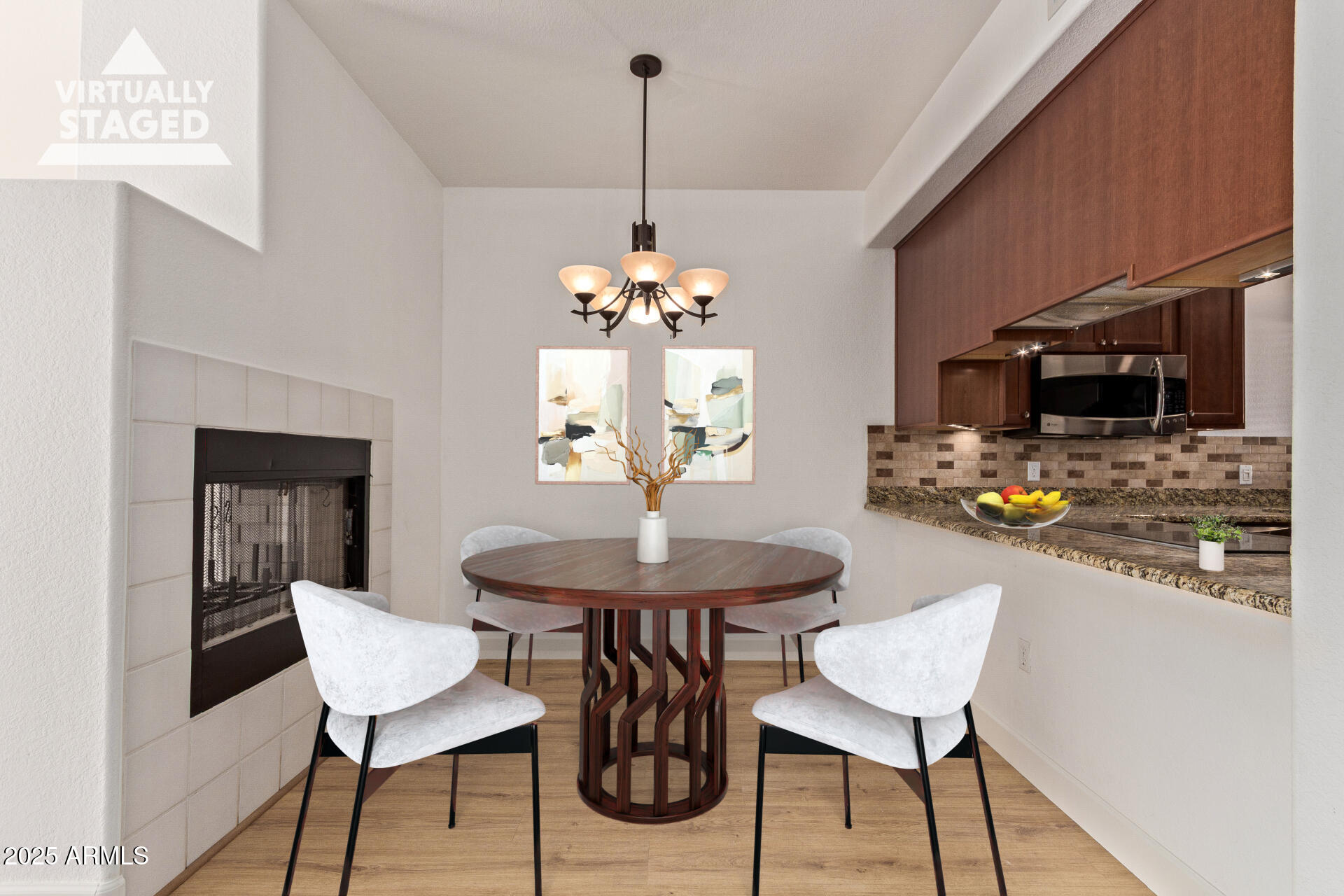 7101 West Beardsley Road, Unit 451 Glendale, AZ 85308 - Photo 6 of 26 a dining room with furniture a chandelier and wooden floor