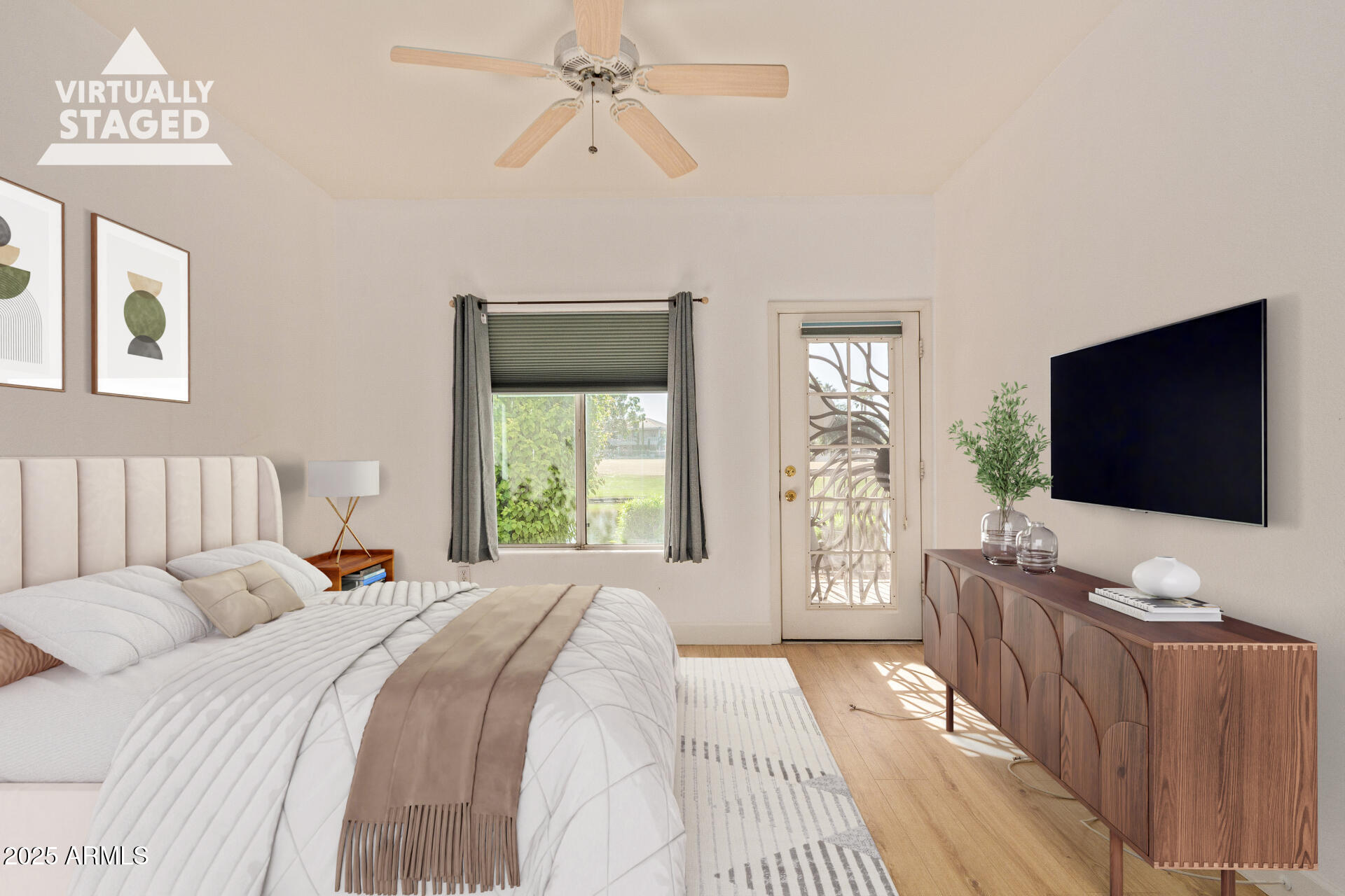 7101 West Beardsley Road, Unit 451 Glendale, AZ 85308 - Photo 9 of 26 a bedroom with a bed and a flat screen tv