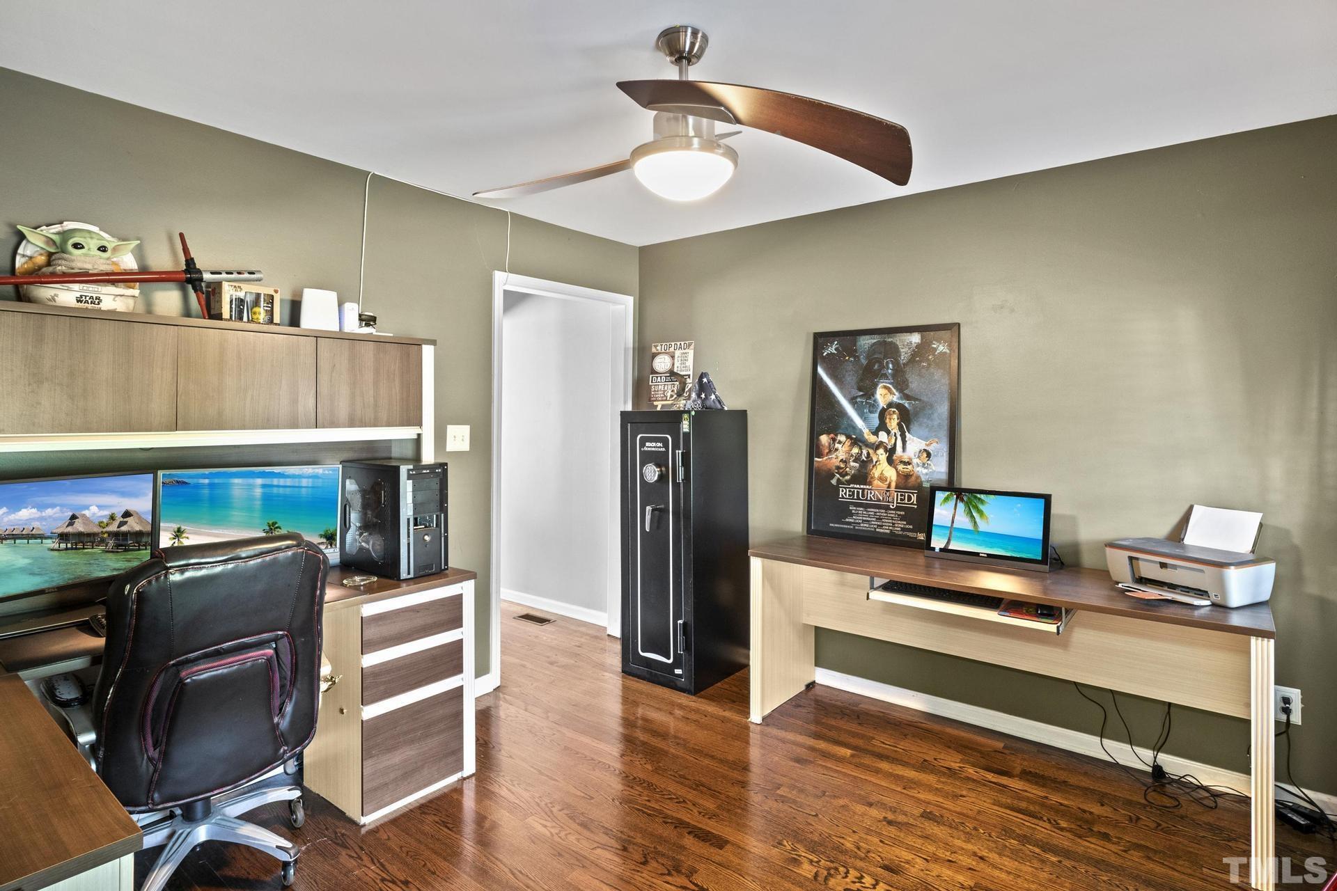 117 Mendel Drive Smithfield, NC 27577 - Photo 19 of 39 a workspace with furniture and wooden floor