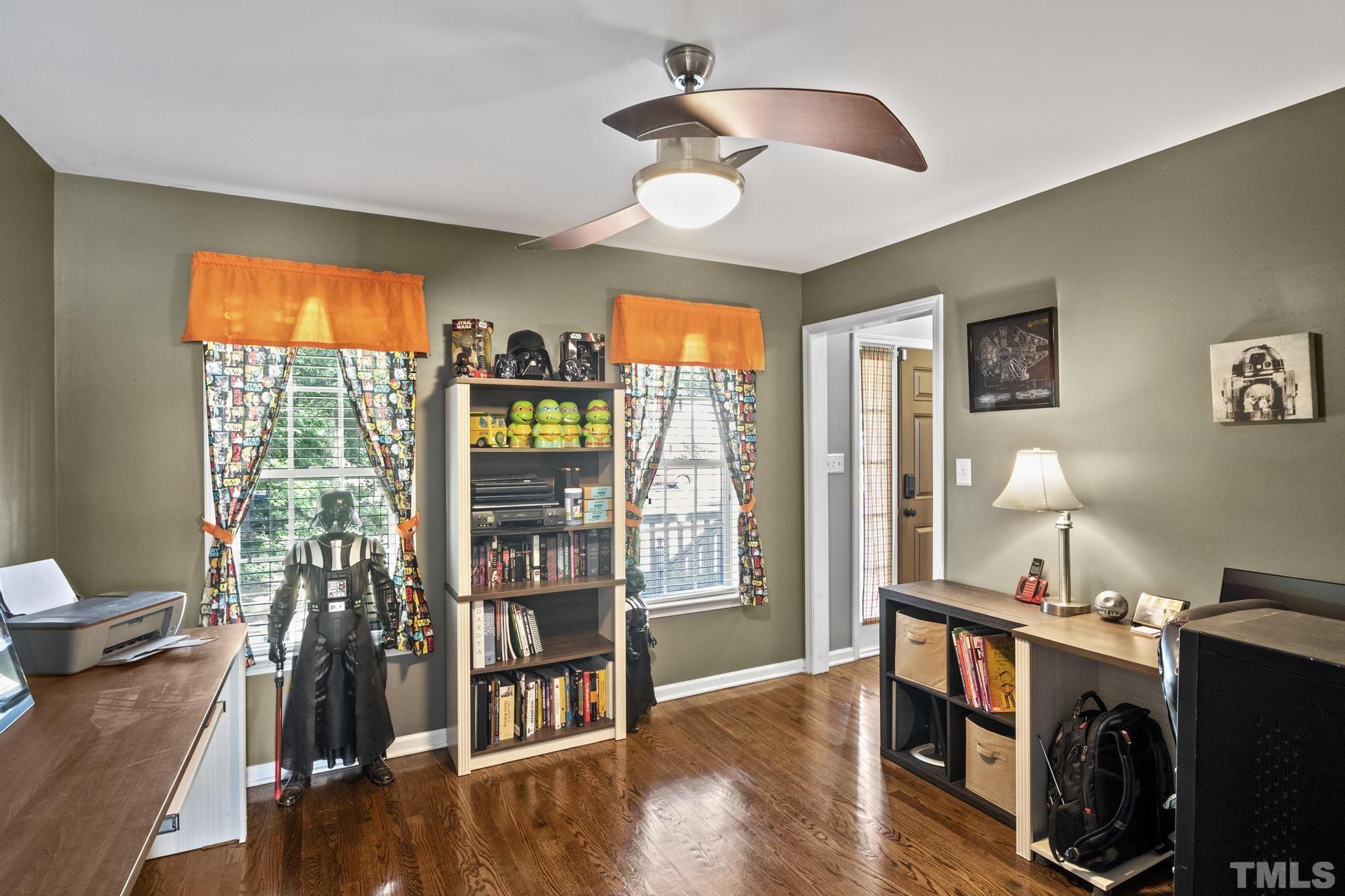 117 Mendel Drive Smithfield, NC 27577 - Photo 20 of 39 a view of a livingroom with furniture hardwood floor and a flat screen tv