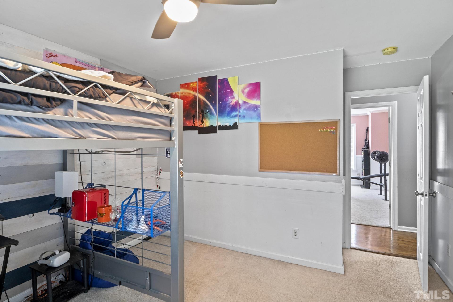 117 Mendel Drive Smithfield, NC 27577 - Photo 30 of 39 a view of storage and utility room with racks on the wall