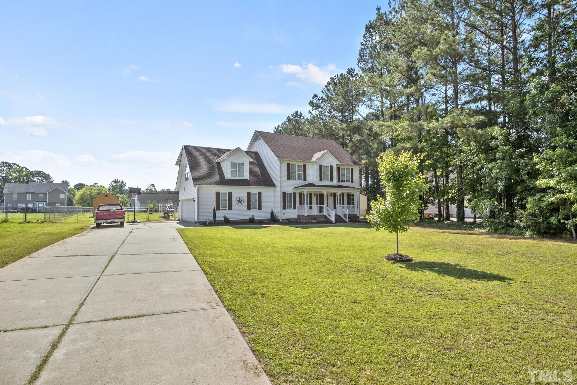 117 Mendel Drive Smithfield, NC 27577 - Photo 37 of 39 a view of a house with swimming pool and a yard