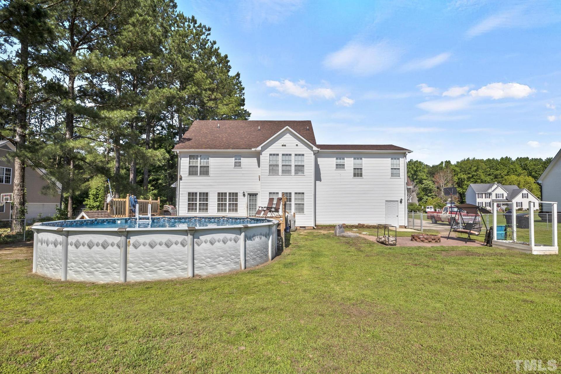 117 Mendel Drive Smithfield, NC 27577 - Photo 38 of 39 a view of a house with a big yard and large tree