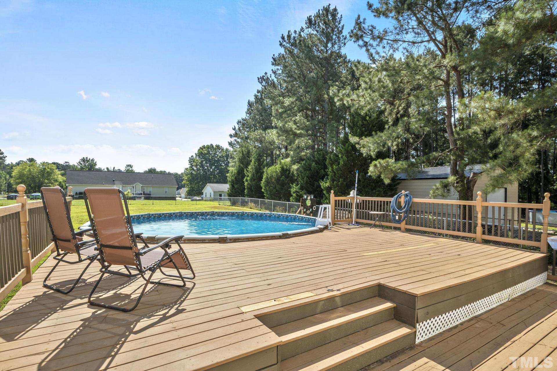 117 Mendel Drive Smithfield, NC 27577 - Photo 4 of 39 a view of a chairs and table on the terrace