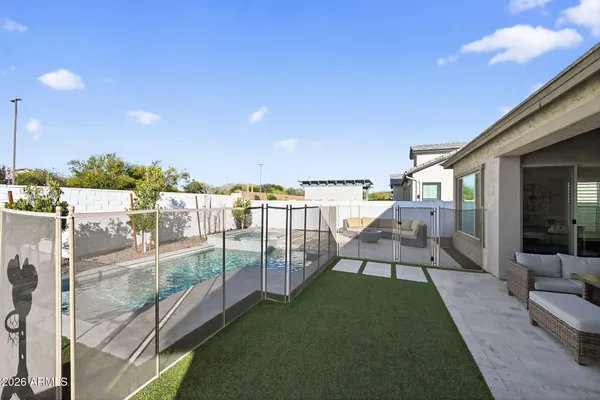 a view of a balcony with floor to ceiling windows yard and outdoor view