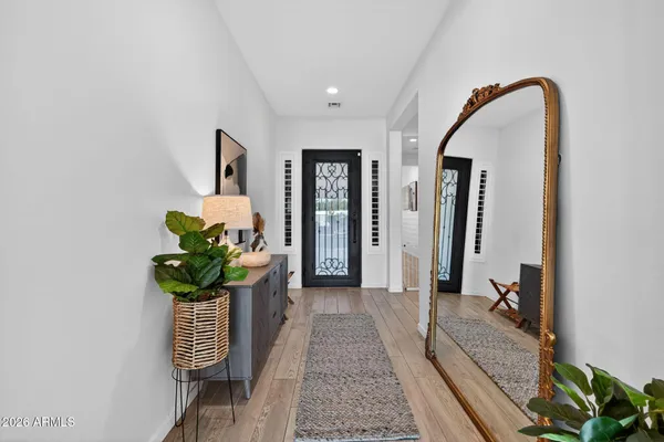a living room with lots of furniture and potted plants