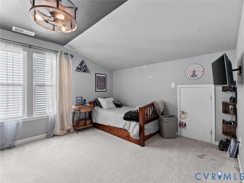 7434 South Franklins Way Quinton, VA 23141 - Photo 18 of 31 Carpeted room featuring a sloped ceiling and two w