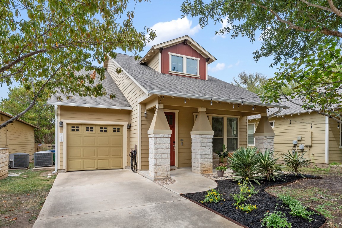 6020 Rutledge Lane Austin, TX 78745 - Photo 9 of 40 a front view of a house with a yard and garage